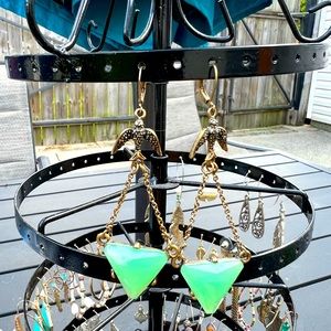 Green triangle drop earrings with bird accent